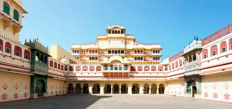 Stunning courtyard view of the majestic City Palace in Jaipur, Rajasthan, showcasing historic Rajput architecture.