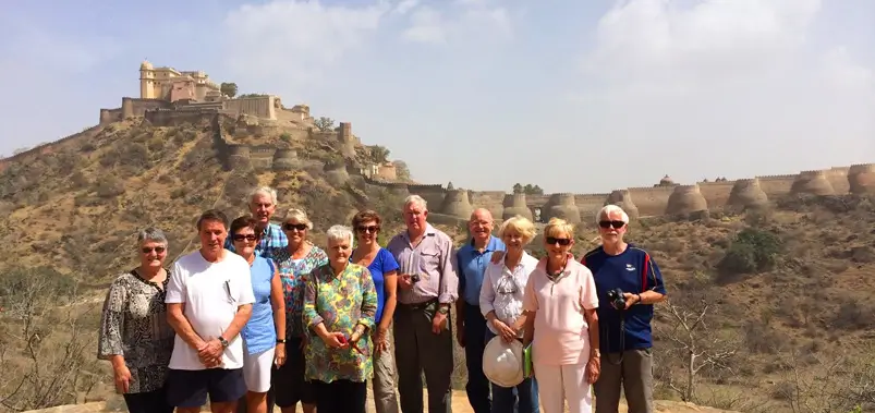 International-tourists-group-posing-near-an-ancient-fort