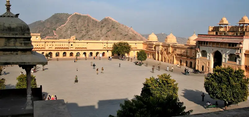 Scenic view of a large historical courtyard and surrounding fort architecture